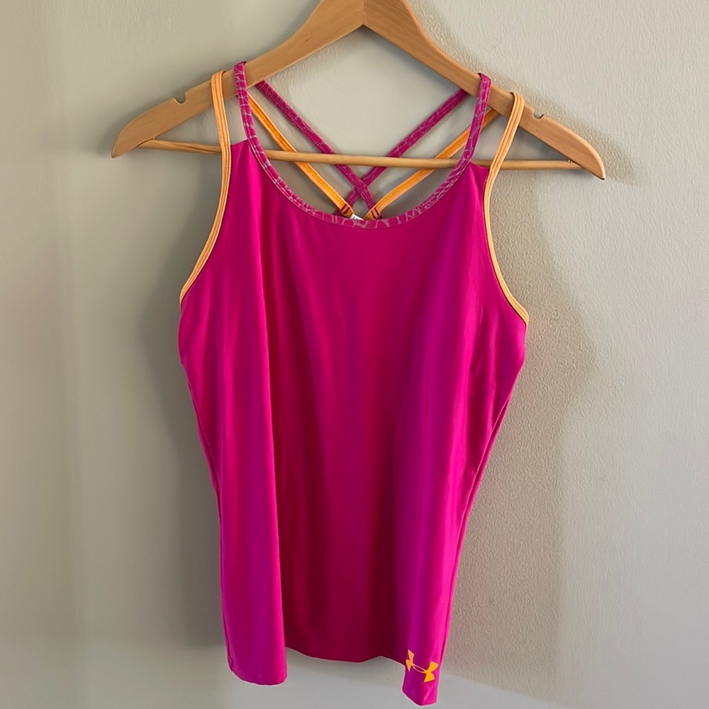 Hot pink workout top with orange detailing by Under Armour